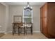 Breakfast nook with wood top table and two chairs at 3720 Ryegrass St, Clermont, FL 34714
