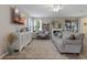 Living room with hardwood floors, neutral walls, and comfortable seating at 3720 Ryegrass St, Clermont, FL 34714