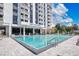 Community pool with plenty of lounge chairs at 400 E Colonial Dr # 806, Orlando, FL 32803