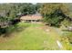 Ranch house with a large backyard and a fire pit at 4135 Chuluota Rd, Orlando, FL 32820