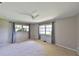 Well-lit bedroom with neutral walls and carpeting at 4135 Chuluota Rd, Orlando, FL 32820