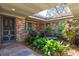 Inviting courtyard entry with lush landscaping at 4135 Chuluota Rd, Orlando, FL 32820