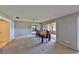 Dining area with wood table and chairs, near access to living room and sunroom at 4135 Chuluota Rd, Orlando, FL 32820