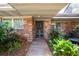 Brick entryway with lush landscaping and a courtyard at 4135 Chuluota Rd, Orlando, FL 32820