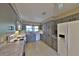 Kitchen boasts gray cabinets, marble countertops and white appliances at 4135 Chuluota Rd, Orlando, FL 32820