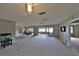 Spacious living room with carpeting, fireplace, and sliding glass doors leading to a patio at 4135 Chuluota Rd, Orlando, FL 32820