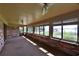 Relaxing sunroom overlooking a lake, complete with brick walls and large windows at 4135 Chuluota Rd, Orlando, FL 32820
