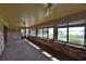 Sunroom overlooking the lake with brick walls at 4135 Chuluota Rd, Orlando, FL 32820