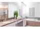 Bathroom with double vanity and tub at 4152 Paragraph Dr, Kissimmee, FL 34746