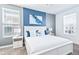 Bedroom with king bed and blue decor at 4152 Paragraph Dr, Kissimmee, FL 34746