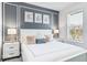 Bright bedroom with a king-size bed and gray accent wall at 4152 Paragraph Dr, Kissimmee, FL 34746