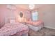Charming ' bedroom with pink bedding and elegant decor at 4152 Paragraph Dr, Kissimmee, FL 34746