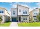 Two-story modern home with gray siding and a gray garage door at 4152 Paragraph Dr, Kissimmee, FL 34746