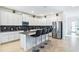 Modern kitchen with white cabinets, stainless steel appliances, and an island at 4152 Paragraph Dr, Kissimmee, FL 34746