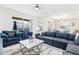 Comfortable living room with sectional sofa and access to backyard at 4152 Paragraph Dr, Kissimmee, FL 34746