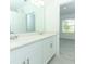 Bathroom with double vanity and view of bedroom at 436 Wayland Dr, Haines City, FL 33844