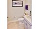 Small half bathroom with gray vanity and white toilet at 4544 Sequel Rd, Kissimmee, FL 34746