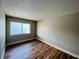 Well-lit bedroom with wood-look flooring and a window at 4771 S Texas Ave # 4771C, Orlando, FL 32839