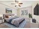 Bright bedroom featuring a comfortable bed and large window at 4876 Conway Rd # 96, Orlando, FL 32812