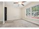 Well-lit bedroom with ceiling fan and window at 4876 Conway Rd # 96, Orlando, FL 32812