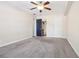 Bright bedroom with ceiling fan and en-suite bathroom access at 4876 Conway Rd # 96, Orlando, FL 32812