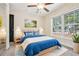 Well-lit bedroom with a queen bed and plenty of natural light at 4876 Conway Rd # 96, Orlando, FL 32812