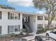 Two-story building with stairs and balconies at 4876 Conway Rd # 96, Orlando, FL 32812