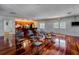 Community room with kitchen, chairs and hardwood floors at 4876 Conway Rd # 96, Orlando, FL 32812