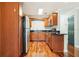 Modern kitchen with stainless steel appliances and wood cabinets at 4876 Conway Rd # 96, Orlando, FL 32812