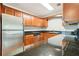 Modern kitchen features stainless steel appliances and dark granite countertops at 4876 Conway Rd # 96, Orlando, FL 32812