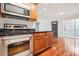 Kitchen with stainless steel appliances and wood cabinets at 4876 Conway Rd # 96, Orlando, FL 32812
