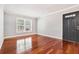 Living room with hardwood floors and a door to the outside at 4876 Conway Rd # 96, Orlando, FL 32812