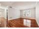 Spacious living room with hardwood floors and neutral walls at 4876 Conway Rd # 96, Orlando, FL 32812