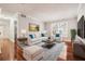 Bright living room with hardwood floors, comfy seating, and large window at 4876 Conway Rd # 96, Orlando, FL 32812