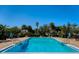 Inviting community pool with lounge chairs and umbrellas at 4876 Conway Rd # 96, Orlando, FL 32812