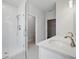 Modern bathroom features a double sink with white countertops and glass enclosed shower at 520 Orient Ave, Debary, FL 32713