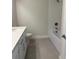 Bright bathroom with a shower-tub combo, neutral walls, and a modern vanity at 520 Orient Ave, Debary, FL 32713