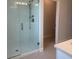 Modern bathroom featuring a glass-enclosed shower with sleek fixtures and contemporary tile work at 520 Orient Ave, Debary, FL 32713