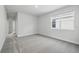 A bedroom featuring neutral carpet, a large window, and ample natural light at 520 Orient Ave, Debary, FL 32713