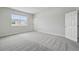 Large bedroom with neutral carpet, one large window, and a closet at 520 Orient Ave, Debary, FL 32713