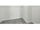A walk-in closet with neutral carpet, wire shelving and white baseboards at 520 Orient Ave, Debary, FL 32713