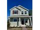 Two-story house with green siding, burgundy door, and landscaping at 520 Orient Ave, Debary, FL 32713