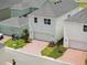 Aerial view of townhomes with brick driveways, garages, and well-maintained landscaping at 520 Orient Ave, Debary, FL 32713
