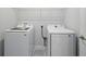 A laundry room with a washer and dryer and wire shelf for storage at 520 Orient Ave, Debary, FL 32713