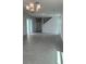 Open living room featuring tile flooring, modern lighting, and sliding glass doors at 520 Orient Ave, Debary, FL 32713