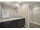 Double vanity bathroom with granite countertop at 5427 Dragonfly Dr, Wildwood, FL 34785