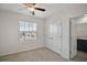 Spacious bedroom with double-door closet and adjacent bathroom at 5427 Dragonfly Dr, Wildwood, FL 34785