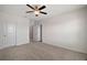 Large bedroom with ceiling fan and carpet at 5427 Dragonfly Dr, Wildwood, FL 34785