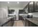 Modern kitchen with stainless steel appliances and granite countertops at 5427 Dragonfly Dr, Wildwood, FL 34785