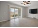 Living room with sliding glass doors to backyard at 5427 Dragonfly Dr, Wildwood, FL 34785